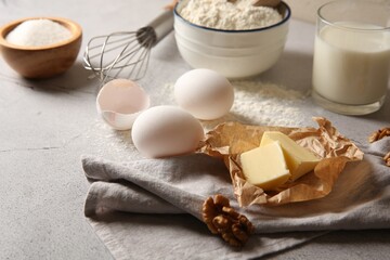 Different ingredients for dough on light table, closeup