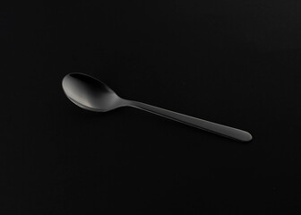 silvel steel spoon on a black backgrond
