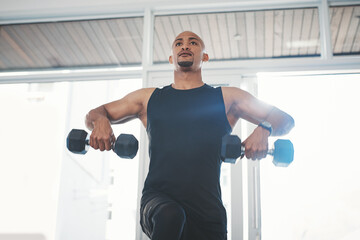 Fitness, dumbbell and black man in gym for training, workout and wellness for healthy routine. Sports, male person and exercise for muscle strength, resilience and cardio or athlete with commitment
