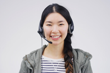Portrait, woman and headset with smile for call centre, communication and pride by white...