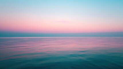 Fototapeta premium The subtle glow of twilight captured on a serene lake, with the light softly transitioning from blue to pink at the horizon