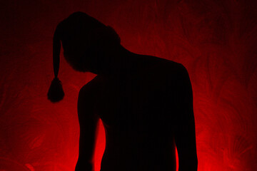 Silhouette of a guy in a New Year's cap, hat, shadows, black, red, mystic, style, art, retro,...