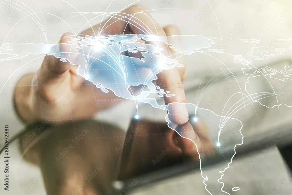 Poster double exposure of abstract digital world map with connections and hand working with a digital table