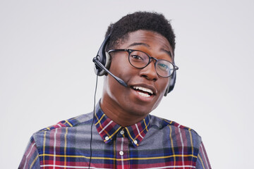 African man, portrait and white background with headphones for customer service or call center,...
