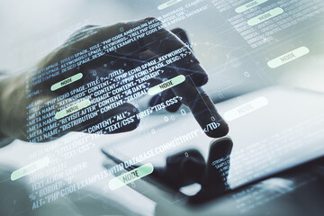 Multi exposure of abstract software development hologram and finger presses on a digital tablet on...