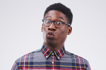 Black man, glasses and portrait in studio for surprise, gossip and pout on white background....