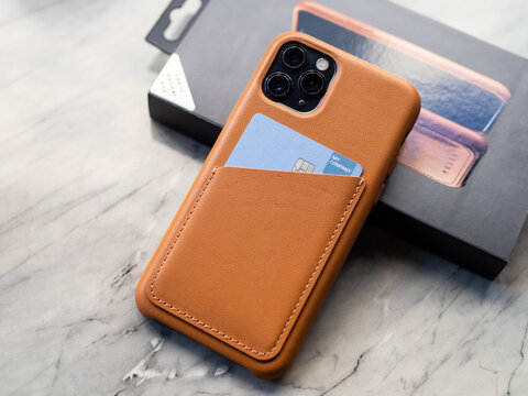 A smartphone with a leather wallet case