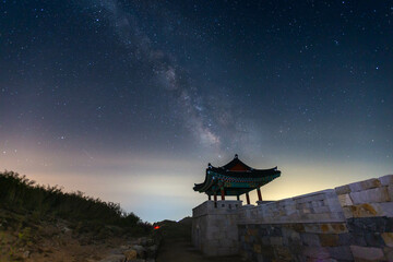 Milky Way at Hwangmaesan Mountain  There is a pavilion in the foreground near Hapcheon-gun, South Korea.
