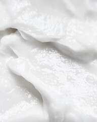 White cosmetic face mask texture close-up
