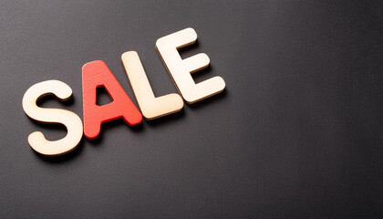 Obraz premium The word SALE on pure black background, copy space on a side