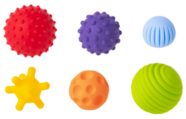 Colorful sensory balls for kids on a white background, designed to enhance cognitive and physical development. Tactics of a soft toys that stimulate children's.
