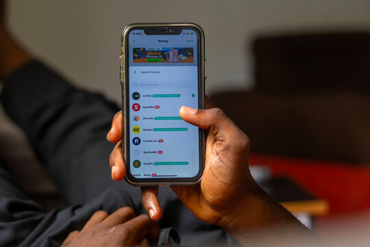 Lagos, Nigeria - May 5 2024 : Closeup logo of African fintech OPay on iPhone. Opay is a Nigeria based company that facilitates mobile and betting transactions through its smartphone app.