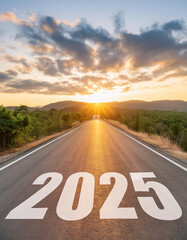View of a landscape with a road running through it in the center reaching to the horizon. The writing 2025 on the asphalt - New Year and business concept