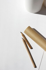 Design Studio Flatlay. Designer Desk with Paper Rolls, Sheets of Paper, Graphite Pencils. Sketching...