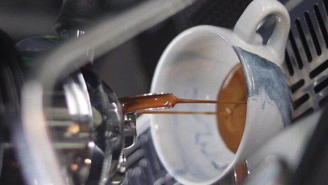 barista making a cup of latte art