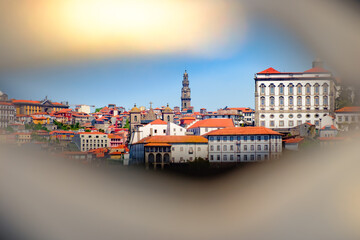 A photograph of the city of Porto intended for tourism on a sunny day. Concept: A city with traditional Portuguese architecture on the banks of the Douro River. - obrazy, fototapety, plakaty
