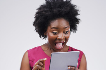 Black woman, tablet and surprise in studio background for social media post, reading text or online...