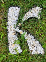 The letter K is an alphabet of white gravel stones.