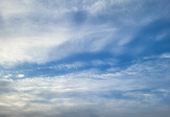 Beautiful blue sky with feathery white clouds.
