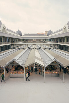 Bustling mercado de bolhao in Porto, Portugal featuring local vendors and shoppers