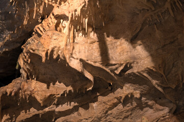 Inside limestone cave - different morphological elements created by driping or flowing water and...