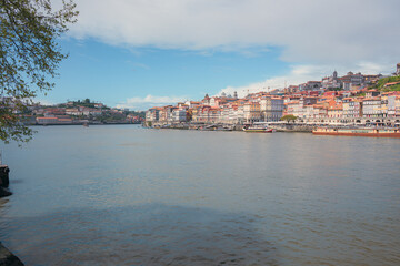 Fototapeta premium Scenic view of Porto historic waterfront and Douro river during daytime