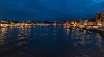 Twilight view of the Douro river and cityscape in Porto, Portugal