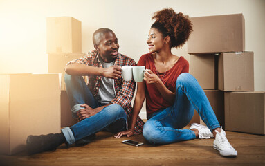 Black couple, cheers and coffee on floor of new home with bonding, support and happy for break from moving. People, homeowner and toast for property investment, dream house and relocation with boxes