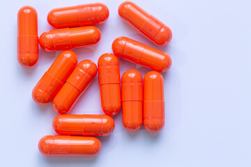 Close-up of orange capsule medicine,Turmeric plus black pepper extract gelatin capsules close up top view. Herbal supplement organic curcumin. Supports antioxidant health