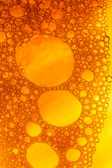 Yellow drink bubble texture close-up,Beer Background Ice Cold Pint With Water Drops Condensation,Golden yellow water drops. Nature collection.