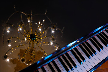 Crystal Lamp Reflected on a Piano in Switzerland.