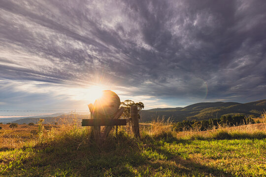 Rural mailbox on ridgeline in regional New South Wales with sun setting in background