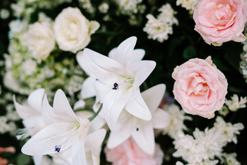 A stunning wedding decoration featuring an array of flowers elegantly combined to create a...
