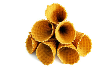 A bunch of waffle cones put on ice cream