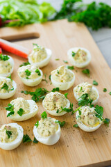 stuffed eggs, deviled eggs on a wooden table