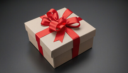 Obraz premium Luxurious gift box adorned with a stunning red bow on a chic black backdrop, perfect for those special occasions 