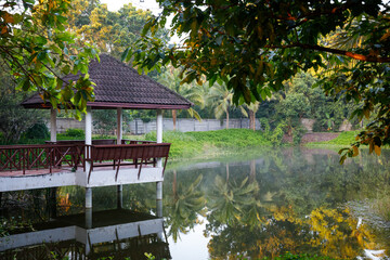 small waterfront pavilion and there are big trees for shade in the countryside of Thailand