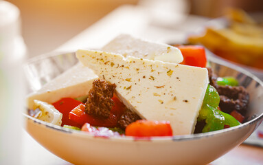 Greek salad with feta cheese, tomatoes and croutons.
