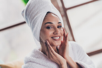 Portrait of gorgeous cheerful american lady toothy smile hands touch apply facial balm pastime flat...