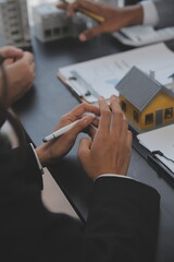 Real estate agent and Sales manager team analysis pricing of rental lease contract of sale purchase agreement, concerning mortgage loan offer for and house insurance.