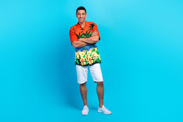 Full length photo of cool funky guy dressed print shirt arms folded isolated blue color background
