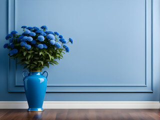 Blue classic wall background, brown parquet floor, home  detail, blue vase of blue flower plant.