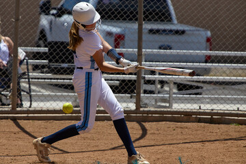 Young Female fastpitch softball player playing club sports.