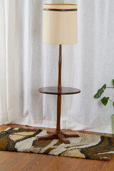 Vintage 1960s table floor lamp. Mid-century modern walnut furniture. Home interior photograph with...