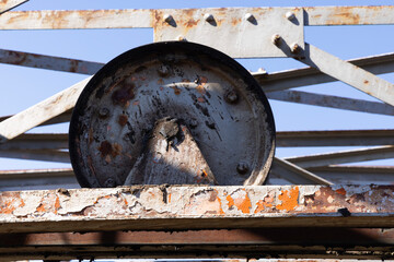Abandoned industrial metal rusted wheel for cableway  mining.