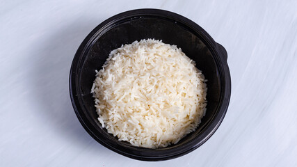Boiled white rice bowl top view