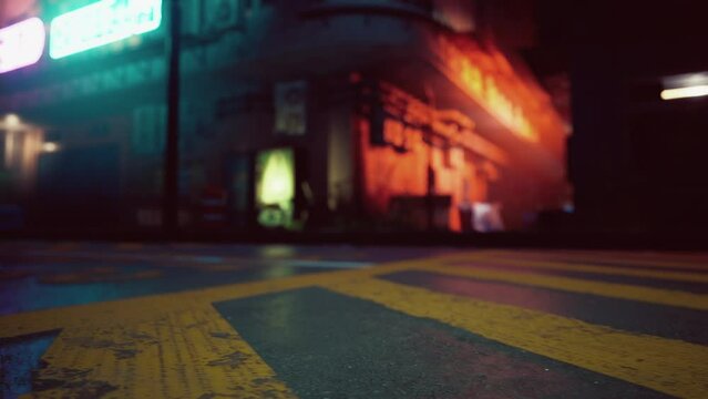 A bustling city street corner at night with blurred lights and movement