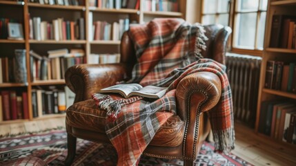 cozy reading nook, a plaid blanket on the leather armchair in the reading nook creates a cozy spot for unwinding with a book on a laid-back afternoon