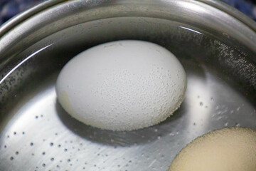 Eggs cooked in a pan with hot water
