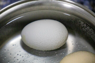 Eggs cooked in a pan with hot water